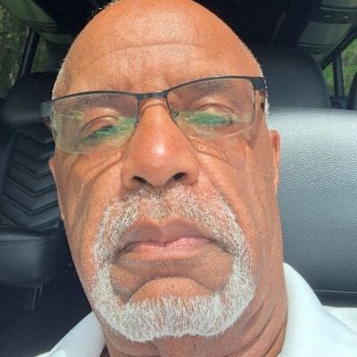 Close-up of bald older man with glasses